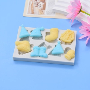 Christmas themed silicone mold featuring hats boots and gloves for cake DIY baking