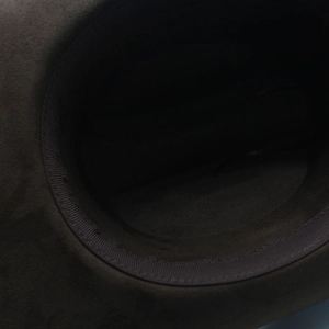 Macro shot of dark brown wool felt hat interior showing inner sweatband and stitching