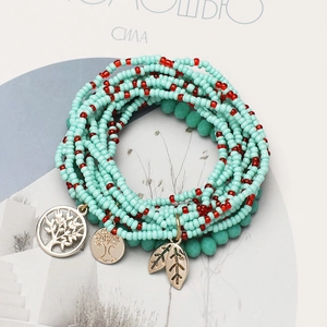Bohemian multi-layer seed bead bracelet set with tree of life and leaf charms in blue and red