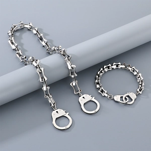 Detail view of silver stainless steel handcuff link chain necklace and bracelet set