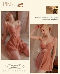Detail of pink lace embroidery and sheer side cut-outs on a silky sexy nightgown