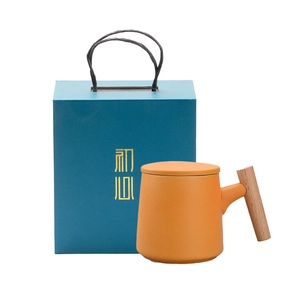 Minimalist ceramic mug with wooden handle and lid in a premium gift box packaging