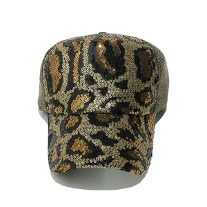 Close-up of leopard print sequins and breathable mesh on a summer baseball cap