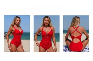 Detail view of red one-piece swimsuit with twist front, tummy control and cross back straps