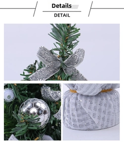 Detail of mini Christmas tree featuring silver bows and glittered base for table decor