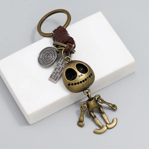 Porte-clés crâne de squelette en bronze vintage avec cuir et breloque gravée