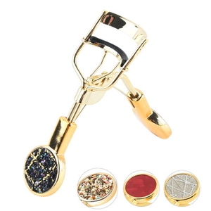 Detail showing various eyelash curler handle inserts in glitter, red agate, and silver