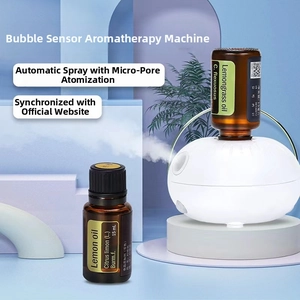 Detail of waterless diffuser with two 15ml essential oil bottles and atomizing nozzle