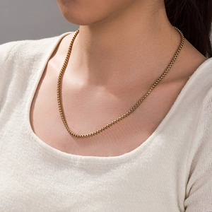 Classic 14k gold plated box chain necklace for men and women on a fashion model