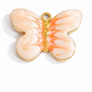 18K gold plated stainless steel butterfly pendant with orange enamel drip design