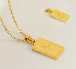 Detailed macro view of gold plated horse zodiac pendant with Buddha carving and fine chain