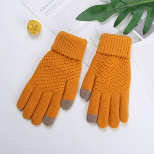 Detail of yellow knit touchscreen gloves with grey conductive fingertips and wool texture
