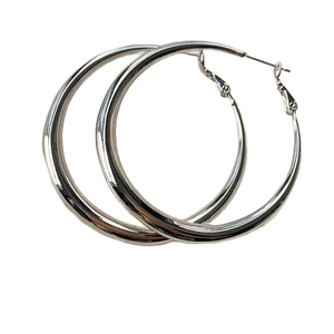 Classic silver metal hoop earrings with a polished surface and minimalist round design