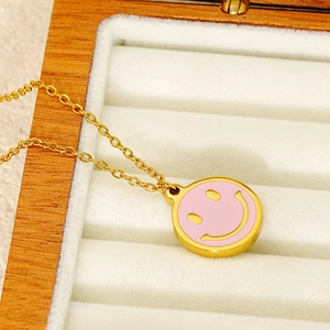 Golden stainless steel necklace featuring a cute pink and yellow smiley face pendant