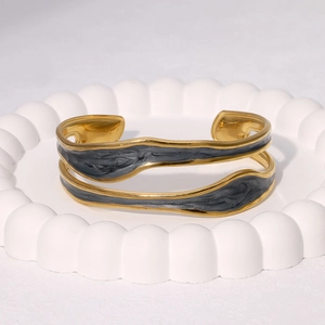 Minimalist gold plated stainless steel open bangle with dark grey enamel abstract inlay
