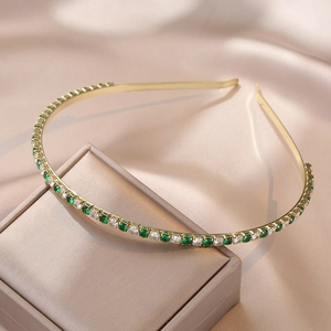 Elegant gold metal headband with emerald green and white square zircons on silk