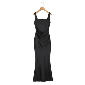Detail of elegant black satin evening dress showing the slim fit and pleated waist design