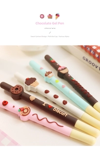 Close-up of dessert-themed gel pens featuring 3D donuts and cupcake decorations