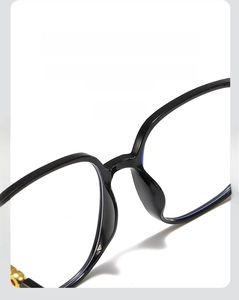 Macro detail of ergonomic one-piece nasal tray on black full-rim glasses frame