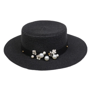 Elegant black straw boater hat featuring pearl and white flower accents for sun protection