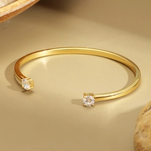 Minimalist 18K gold plated open cuff bracelet with two sparkling cubic zirconia stones