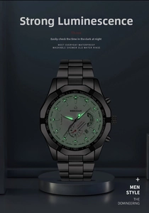 Luminous dial view of a black stainless steel chronograph watch with tachymeter scale