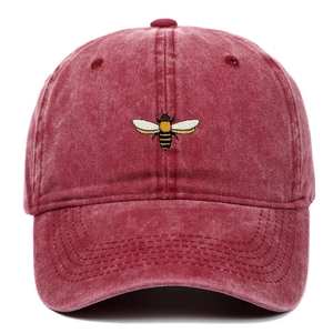 Vintage washed burgundy baseball cap with colorful bee embroidery and curved brim