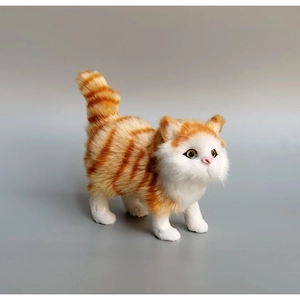 Detail of lifelike orange and white tabby realistic cat plush toy with realistic fur texture