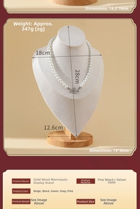 Detailed view of wood and beige velvet bust display stand for necklaces with dimensions