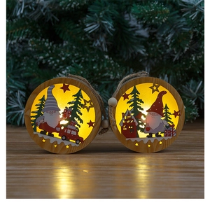 Detail of wooden LED Christmas ornaments with warm light on rustic wooden background
