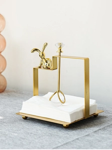 Golden iron rabbit napkin holder with crystal ball weight and elegant metal finish