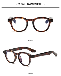 Detailed front and side view of round tortoiseshell retro sunglasses in Hawksbill color