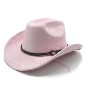 Close-up of pink suede cowboy hat featuring a black woven band and silver bull head charm