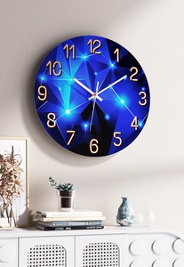 Detail of creative starry night wall clock with gold numbers in a cozy home setting