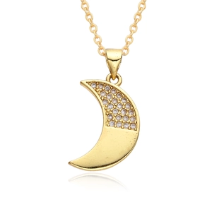 Macro detail of gold plated moon pendant with micro paved white cubic zirconia stones