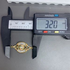 Detailed measurement of a 32mm evil eye pendant with colorful zircon and gold plating