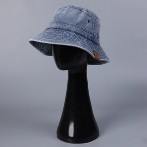Classic washed denim bucket hat in navy blue with vintage leather patch for men and women