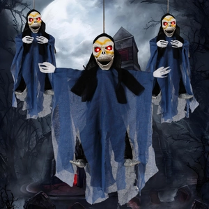 Three hanging Halloween ghosts with glowing red eyes and tattered robes in a dark forest