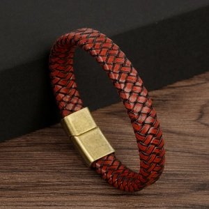 Macro shot of handmade braided leather bracelet with vintage bronze magnetic clasp