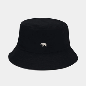 Detailed close-up of white polar bear embroidery on a premium black cotton bucket hat
