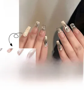 Detail of French style coffin nails with white flame pattern, pearls, and silver stars