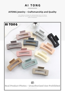 Macro detail of large matte square hair claws in assorted Morandi colors on a white background