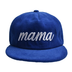 Detail of navy blue corduroy fabric and white 3D embroidery showing mama text on flat brim cap