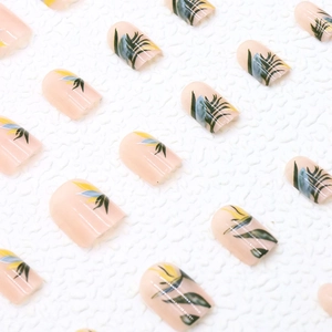 Short square press-on nails with tropical palm leaf ink painting and nude pink base