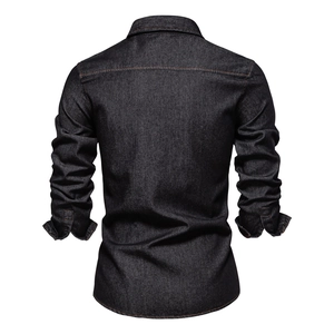Detail view of the back of a dark blue cotton denim shirt with sharp stitching texture