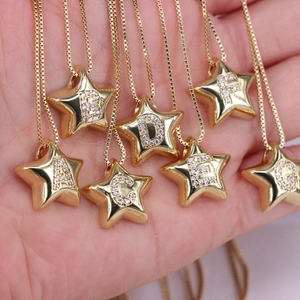 Star shaped gold necklace with zircon letter pendants A to G on a snake chain