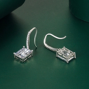 Detail of square zircon drop earrings showing fine S925 silver hallmark and pave setting