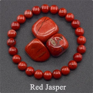Macro view of Red Jasper beaded bracelet with polished natural mineral stones