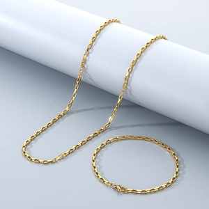 Detail view of the polished golden stainless steel box chain necklace and bracelet set