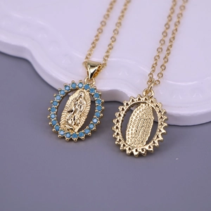 Detail showing Virgin Mary oval pendant with light blue stones and grid back design